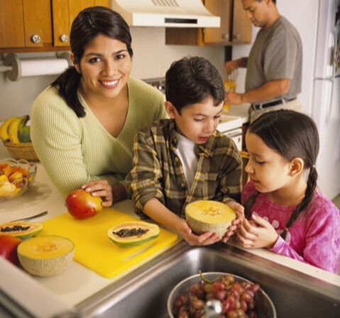 Kids cooking with parent